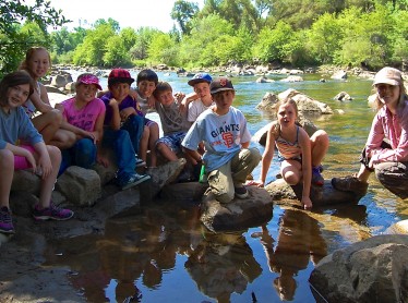 Heather poses with her group of River Science students after a long day of education!